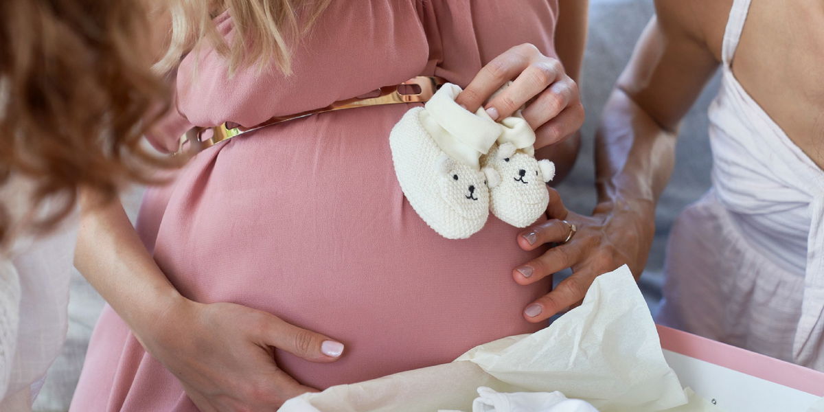 Mother to be opening gifts